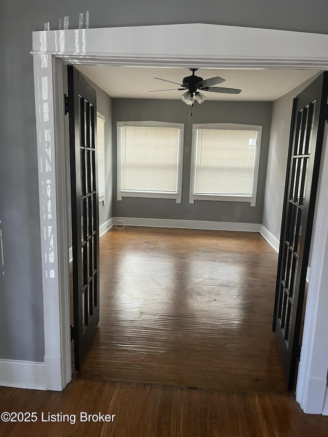 interior space featuring dark hardwood / wood-style flooring, plenty of natural light, and ceiling fan