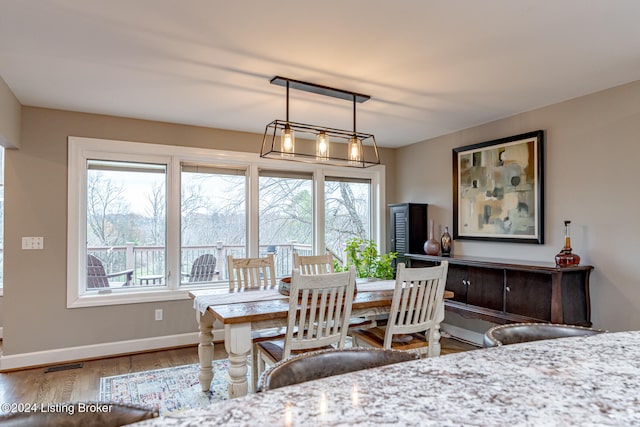 dining room with hardwood / wood-style flooring