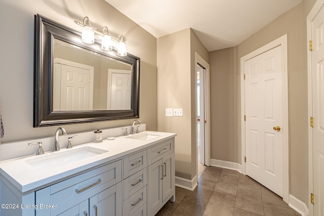 bathroom featuring tile patterned flooring and vanity