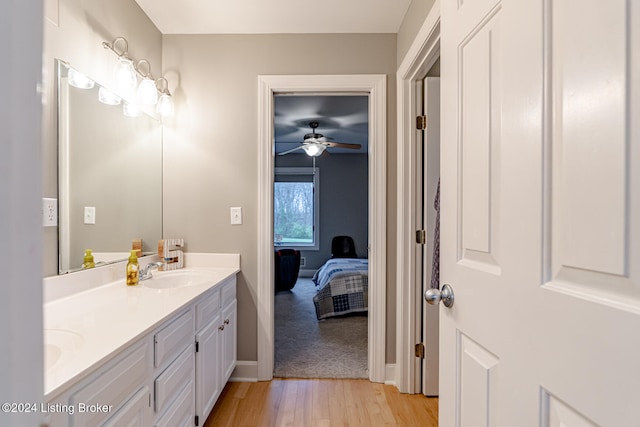 bathroom featuring ceiling fan, vanity, and hardwood / wood-style flooring