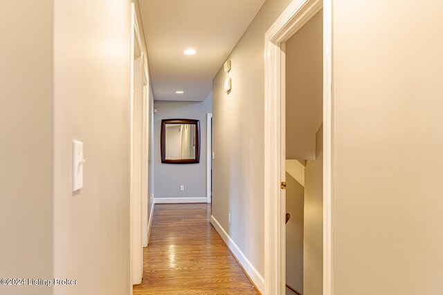 corridor with light hardwood / wood-style flooring