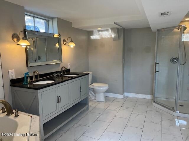 full bathroom with vanity, independent shower and bath, and toilet