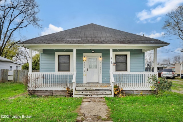 bungalow-style home featuring a front lawn