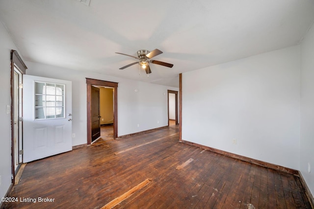 unfurnished room with ceiling fan and dark hardwood / wood-style flooring