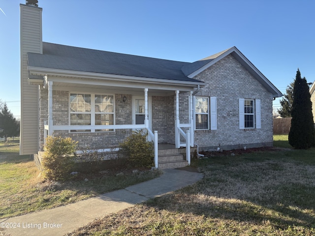 view of front of house featuring a porch and a front yard