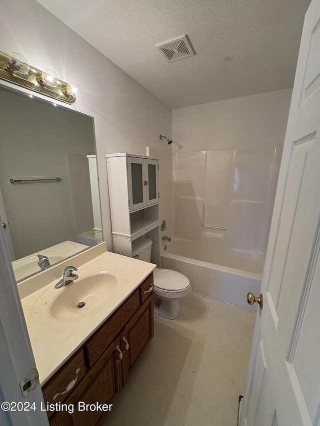 full bathroom with vanity, shower / bathing tub combination, a textured ceiling, and toilet