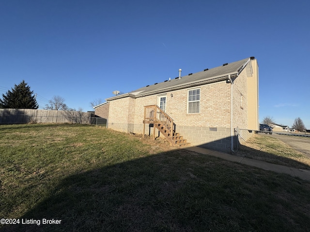 back of house with a yard