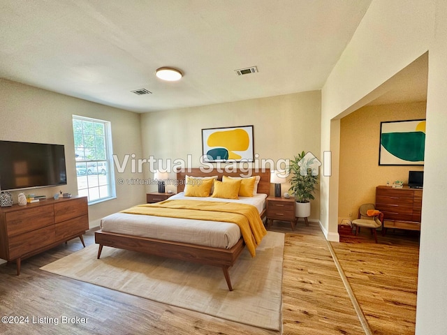 bedroom with wood-type flooring