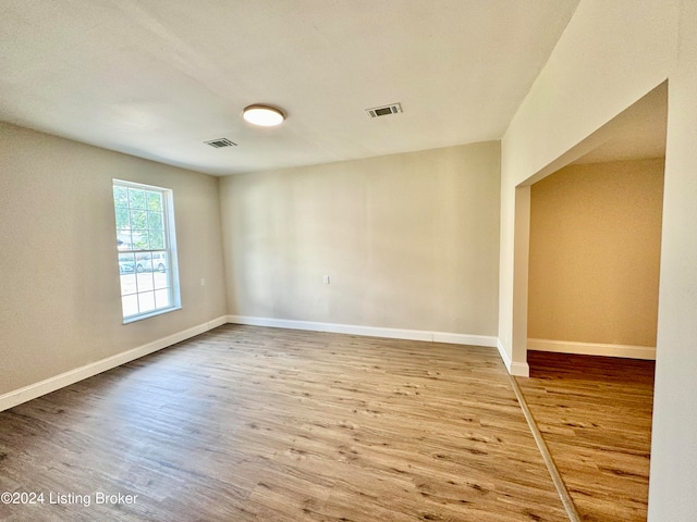 spare room with hardwood / wood-style flooring