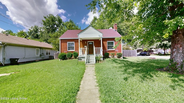 bungalow-style home featuring a front yard