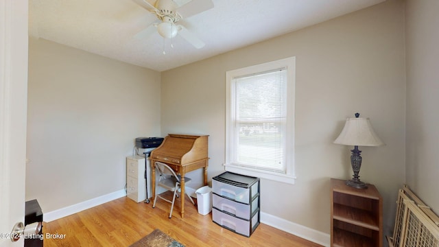 interior space with radiator heating unit, light hardwood / wood-style floors, and ceiling fan