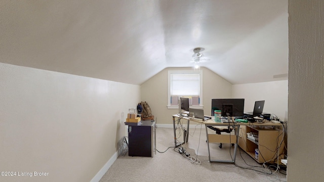 carpeted office featuring vaulted ceiling and ceiling fan