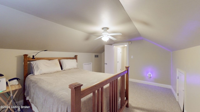 carpeted bedroom featuring ceiling fan and vaulted ceiling