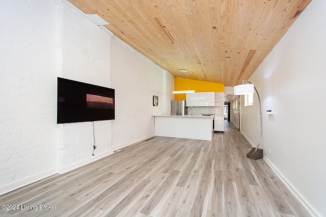 unfurnished living room featuring light wood-type flooring, lofted ceiling, and wooden ceiling