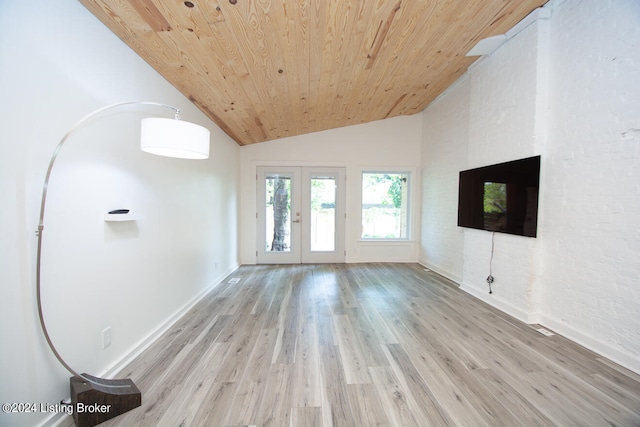 unfurnished living room featuring french doors, wooden ceiling, vaulted ceiling, and light hardwood / wood-style flooring