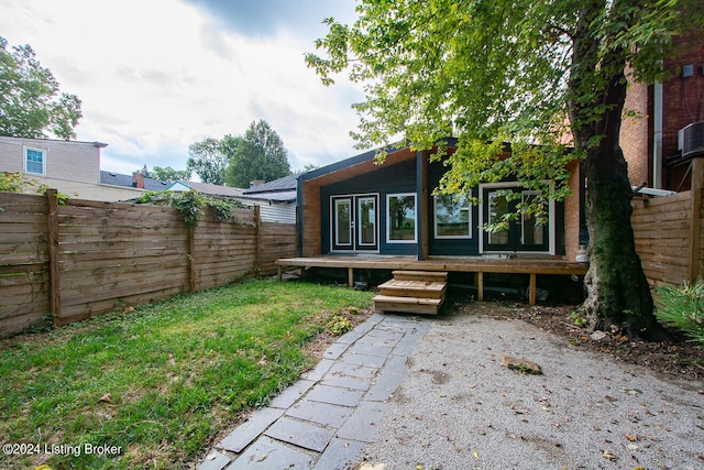 rear view of property featuring french doors