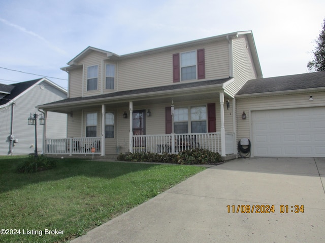 view of front of house with a front lawn, covered porch, and a garage