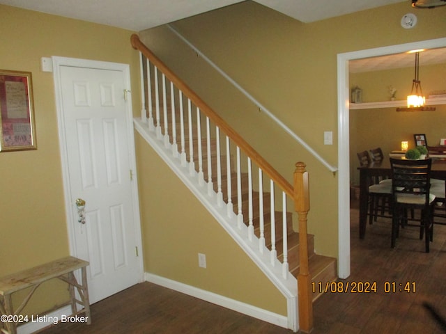 staircase featuring hardwood / wood-style flooring