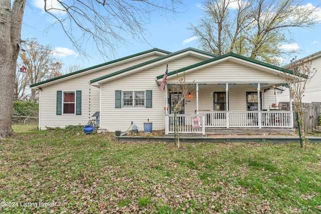 view of front facade with covered porch and a front yard