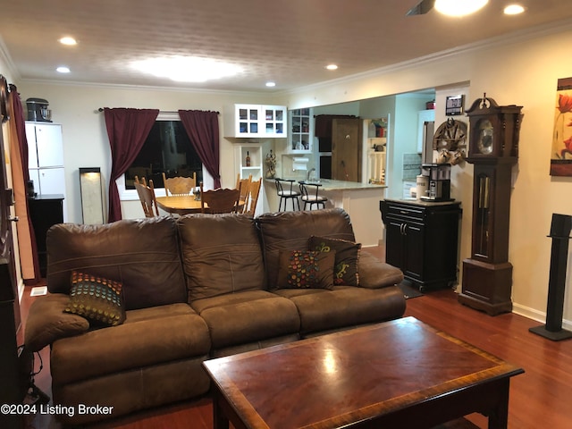 living room featuring dark hardwood / wood-style flooring and ornamental molding