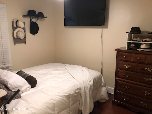 bedroom featuring dark hardwood / wood-style flooring