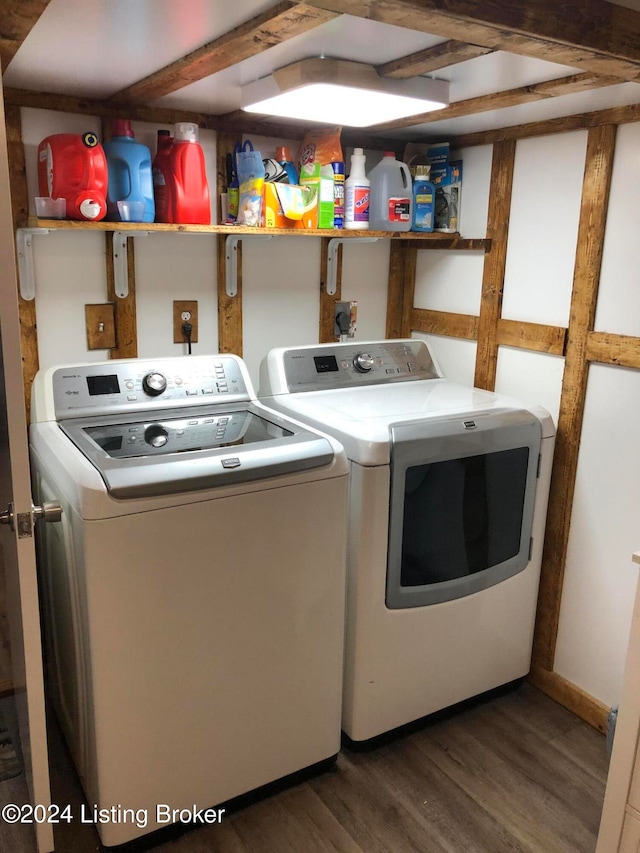 washroom with separate washer and dryer and dark hardwood / wood-style floors