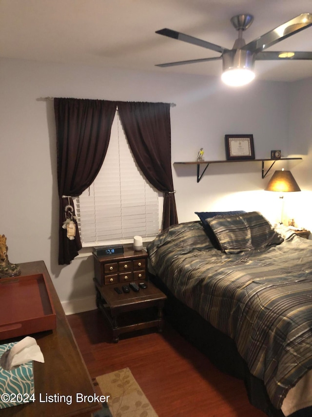 bedroom featuring ceiling fan and dark wood-type flooring