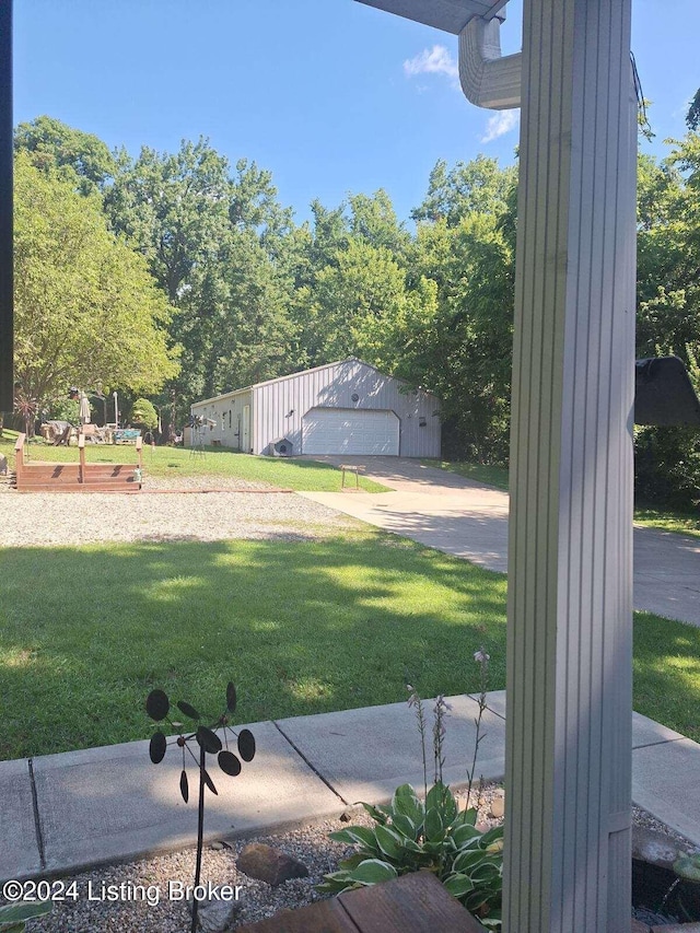 view of yard with an outbuilding and a garage