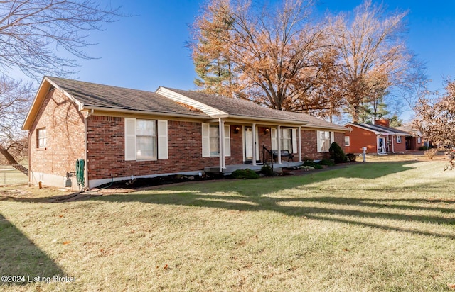 single story home featuring a front lawn