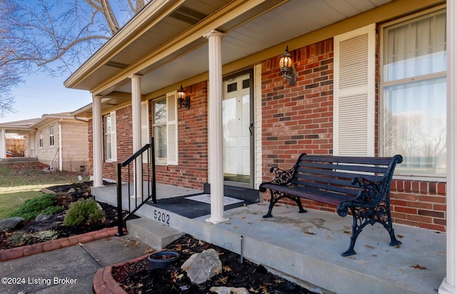 entrance to property featuring a porch