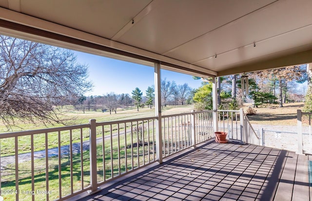 wooden terrace with a rural view