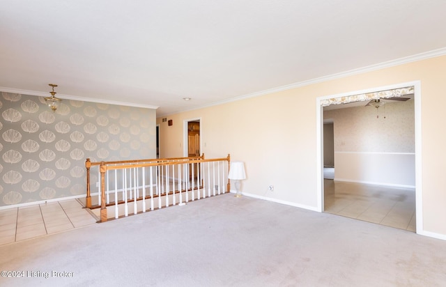 empty room featuring carpet flooring and ornamental molding