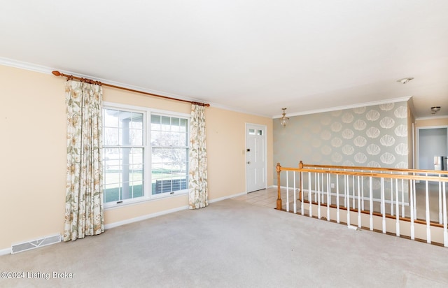 carpeted empty room featuring ornamental molding