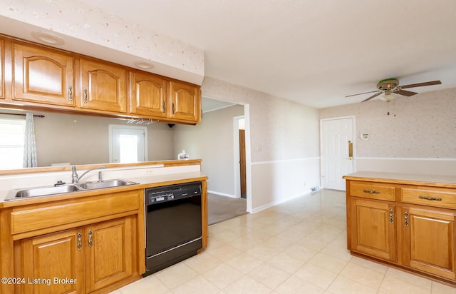 kitchen featuring ceiling fan, sink, and black dishwasher