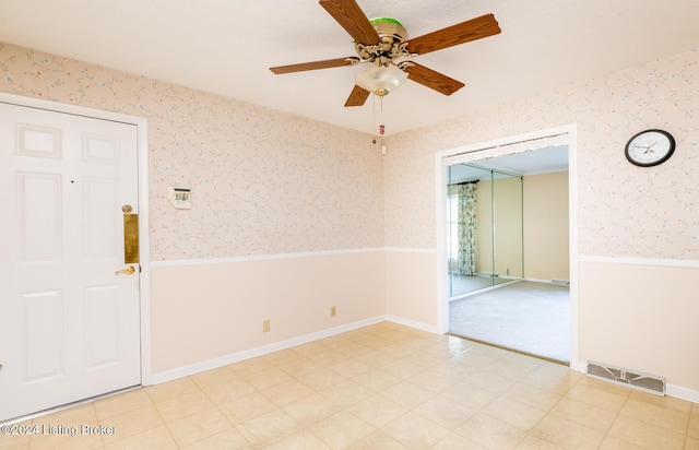 spare room with ceiling fan