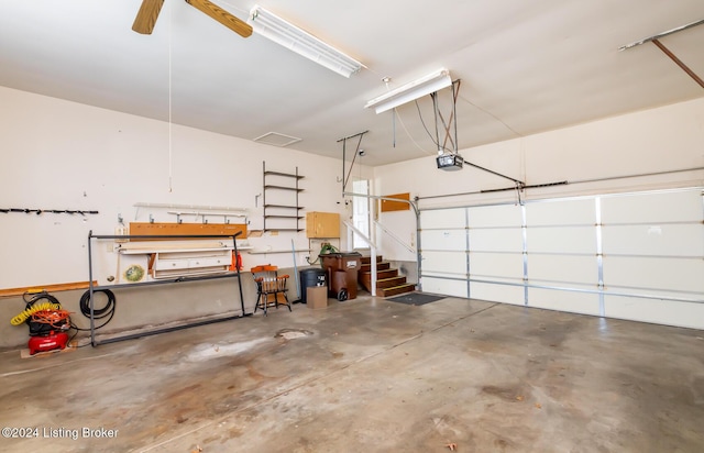 garage with ceiling fan and a garage door opener