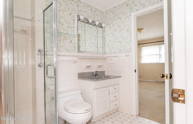 bathroom featuring vanity, toilet, and walk in shower