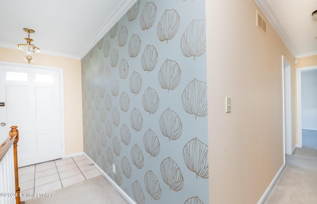 carpeted foyer with crown molding