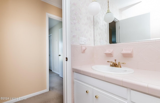 bathroom featuring vanity and backsplash