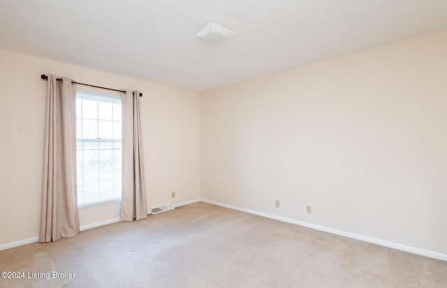 view of carpeted spare room