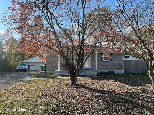 view of front of home with an outbuilding and a garage