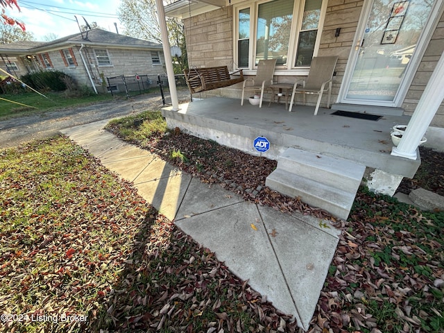 view of patio featuring a porch