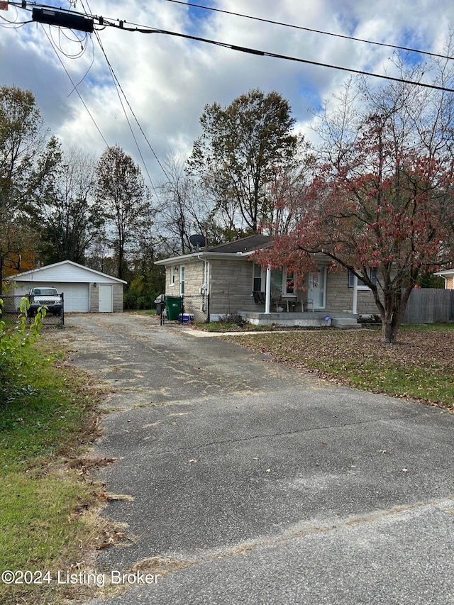 view of front facade with an outdoor structure and a garage