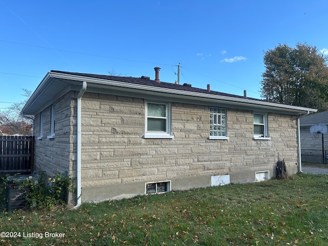 view of property exterior featuring central AC and a yard