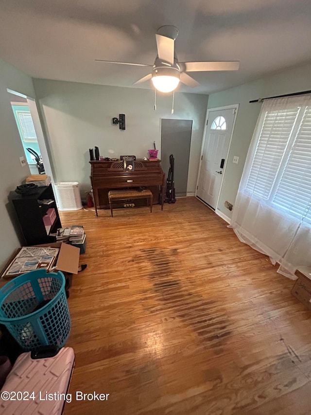 entryway with light hardwood / wood-style floors and ceiling fan