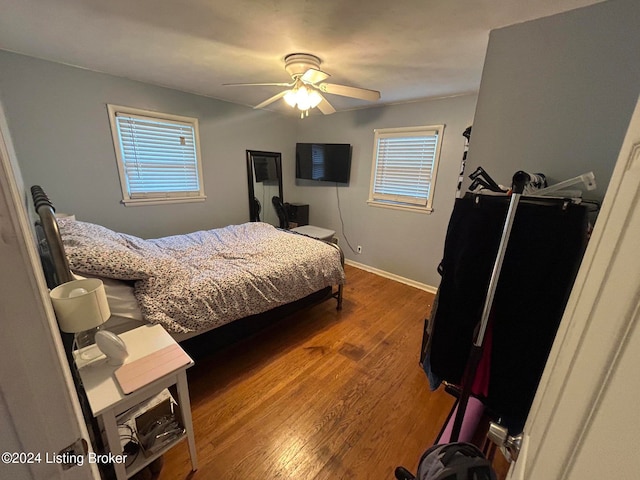 bedroom featuring wood-type flooring and ceiling fan