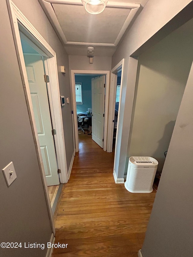 hallway featuring hardwood / wood-style flooring