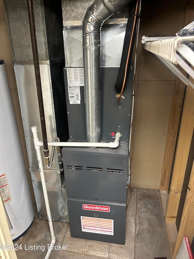 utility room with heating unit and gas water heater