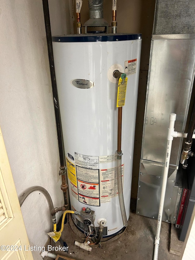 utility room with gas water heater