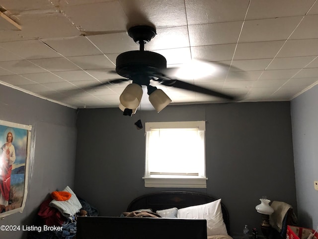 interior space featuring a paneled ceiling and ceiling fan